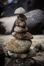 Mini tower made of various stones on rocky beach