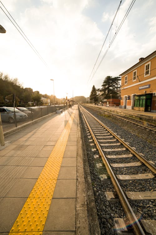 Outdoor railway platform in urban environment