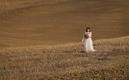 Photo Of Woman Wearing White Dress