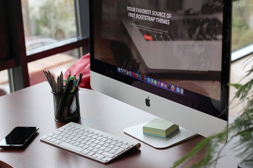 Free Silver Imac Turned on Stock Photo