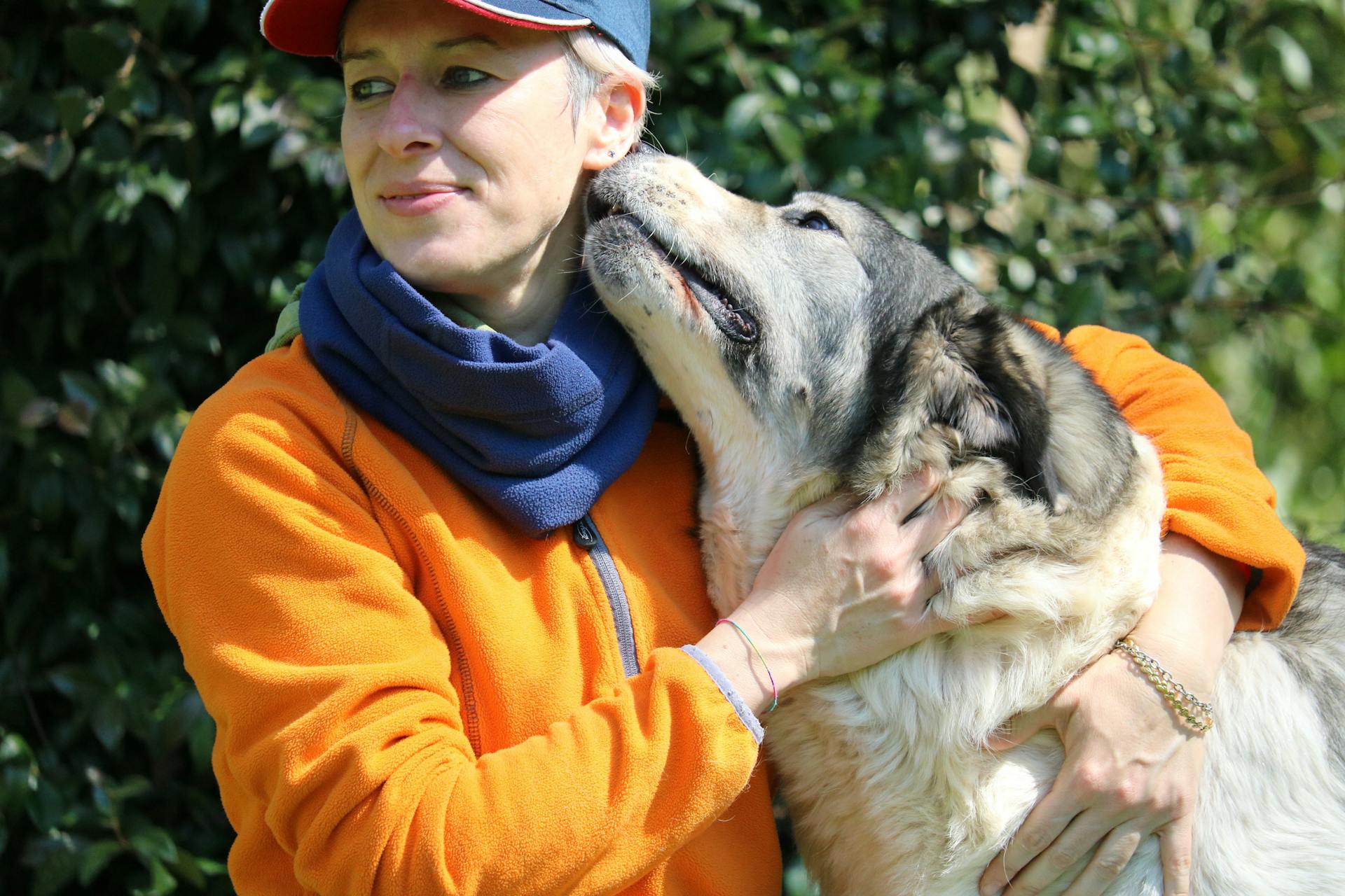 Photo Of Woman Hugging Dog