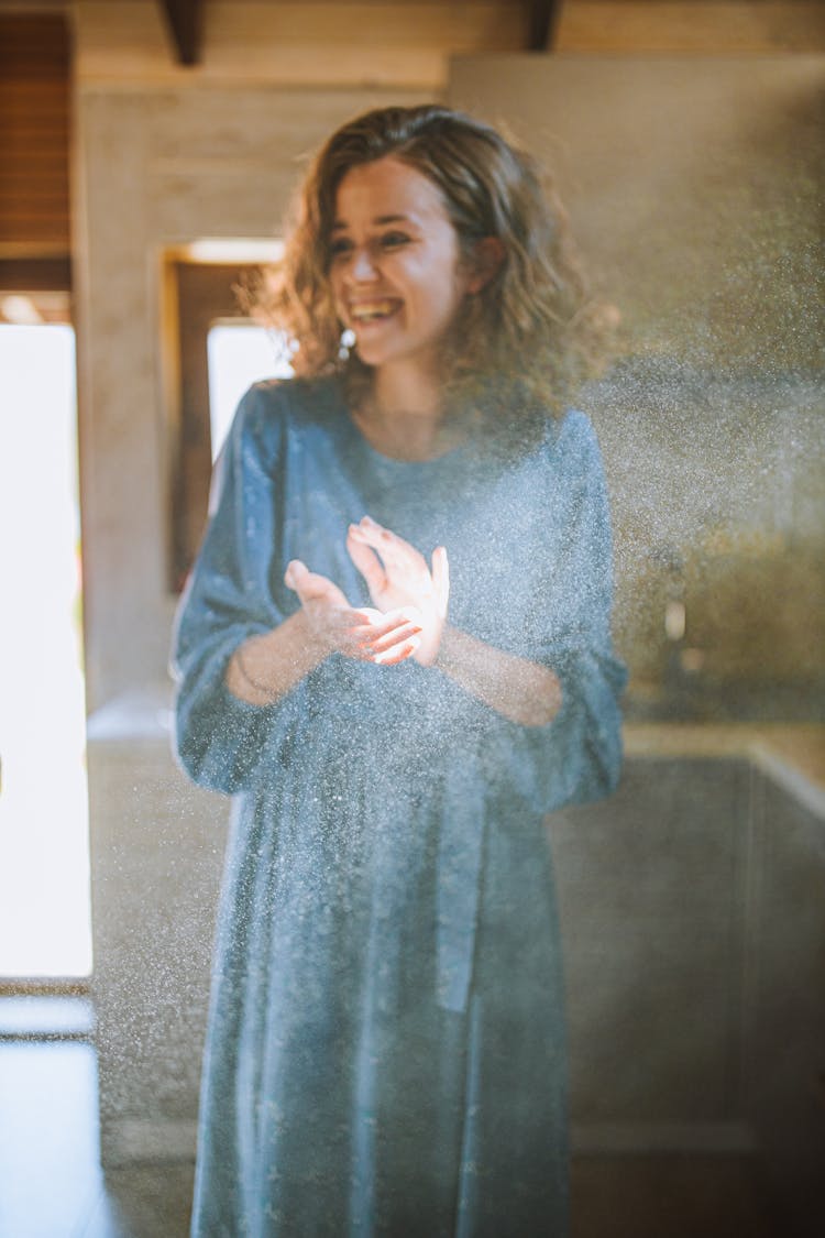 Woman In Blue Long Sleeve Dress Clapping