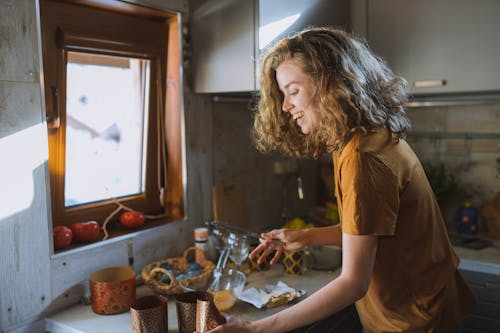 Free Smiling Woman With a Table Knife Stock Photo