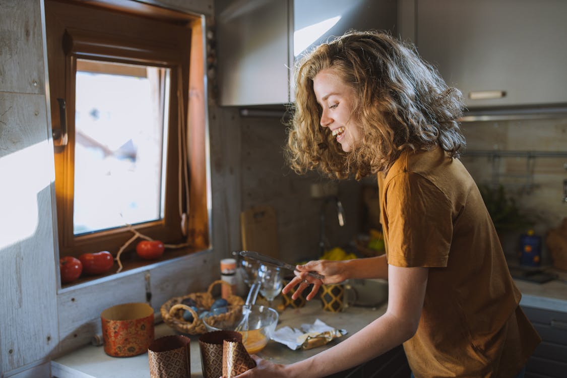 Free Smiling Woman With a Table Knife Stock Photo