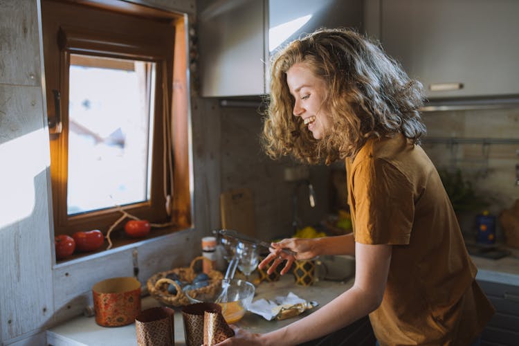 Smiling Woman With A Table Knife