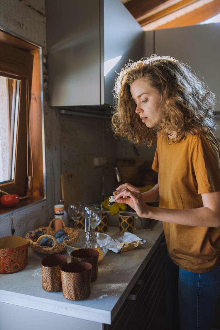 Woman Preparing Food On Counter Top 