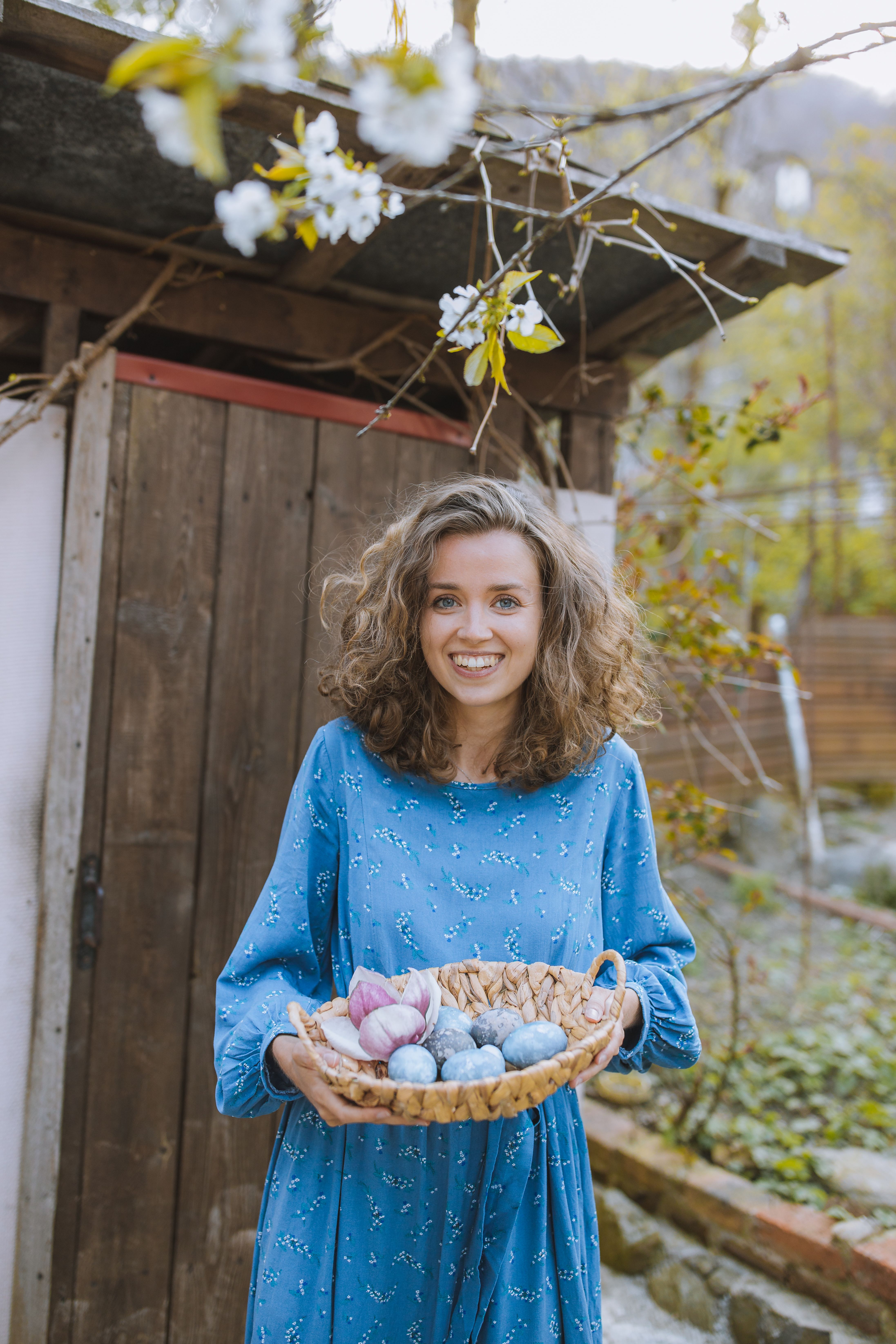 Woman in Blue Long Sleeve Dress Holding a Basket · Free Stock Photo