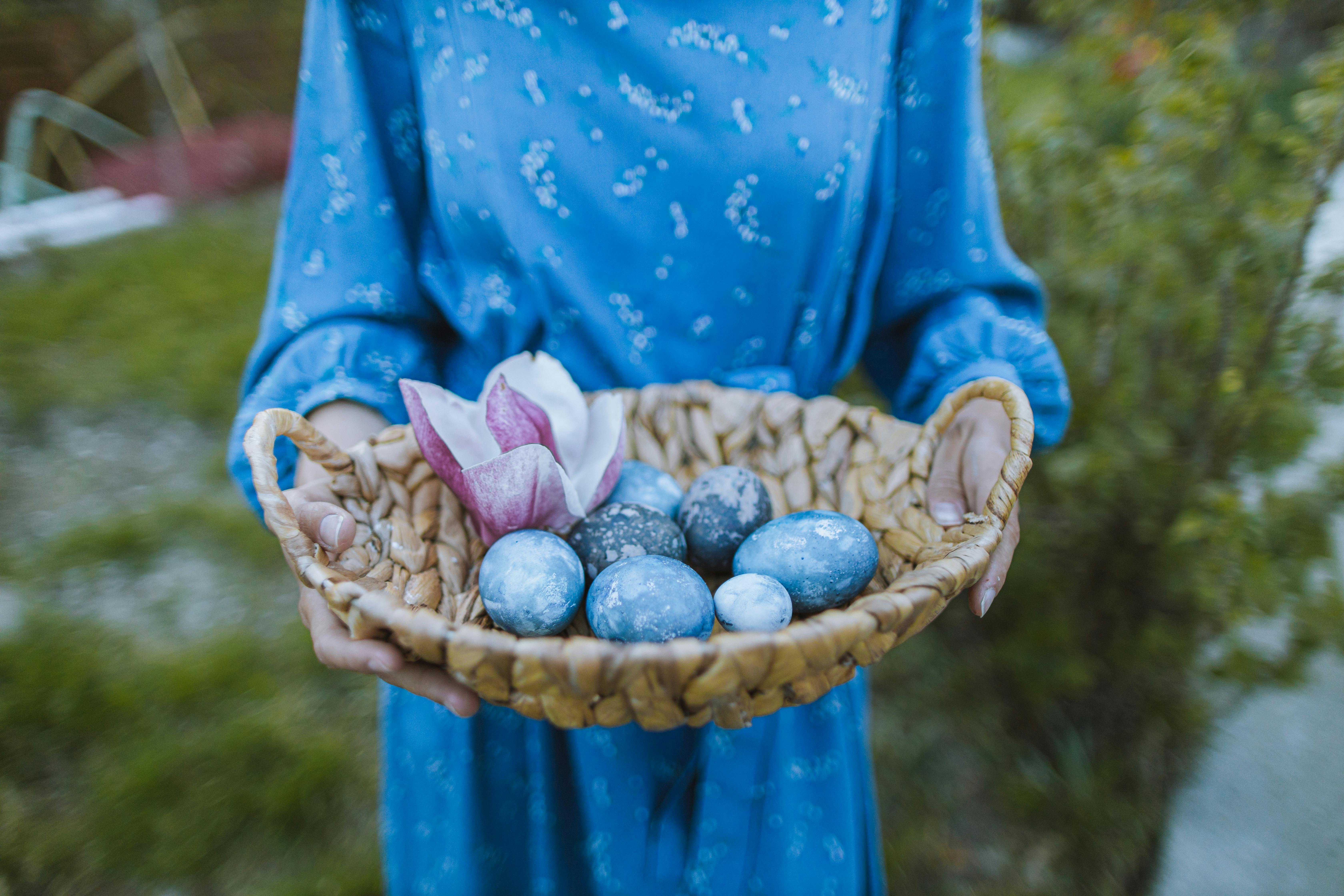 blue eggs on a woven basket