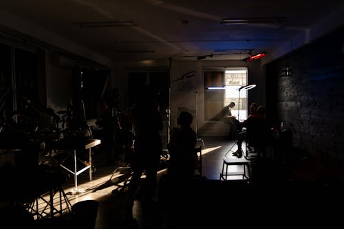 People Sitting on Chairs Inside Room