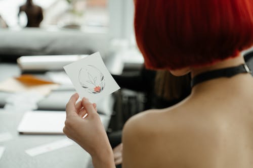 Woman Holding White Printer Paper With Red Heart Drawing