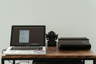 Macbook Pro on Brown Wooden Table