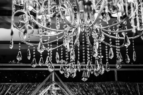 Grayscale Photo of Glass Chandelier