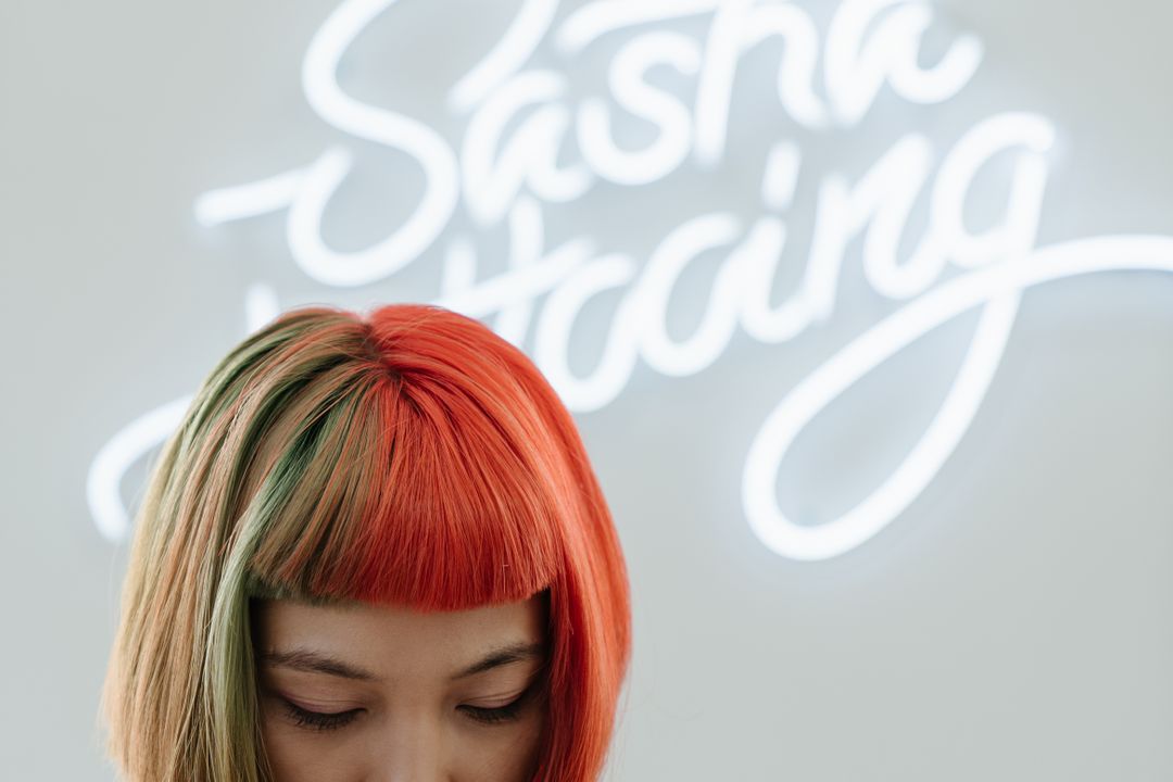 Orange Haired Woman in White Crew Neck Shirt