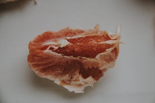 Slice of Fruit on White Surface