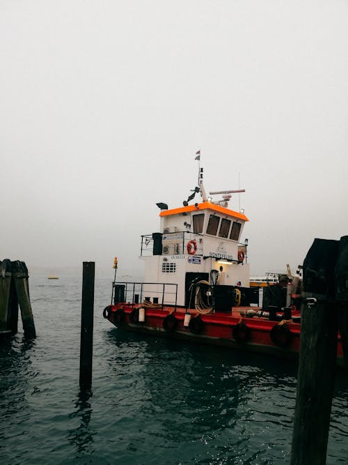 White and Red Boat on Sea