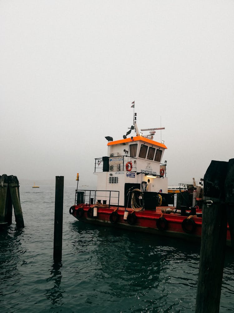 White And Red Boat On Sea