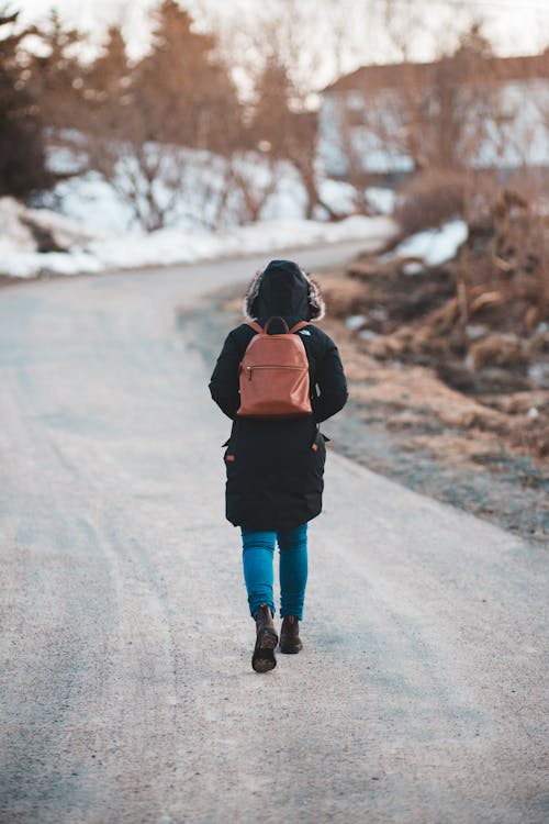 Photo Of Person Walking On Road