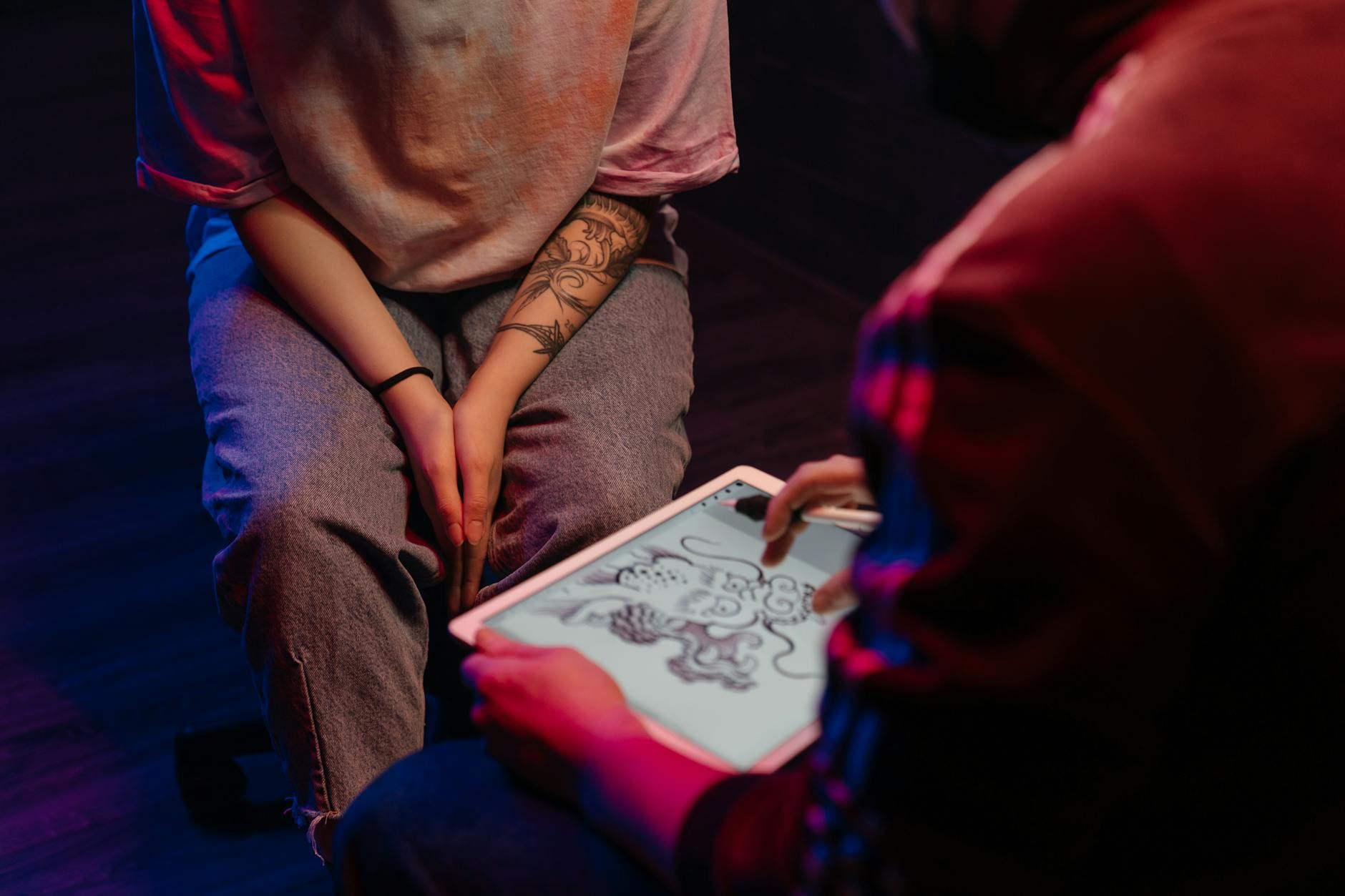 Woman in Brown Shirt and Blue Denim Jeans Sitting on Floor