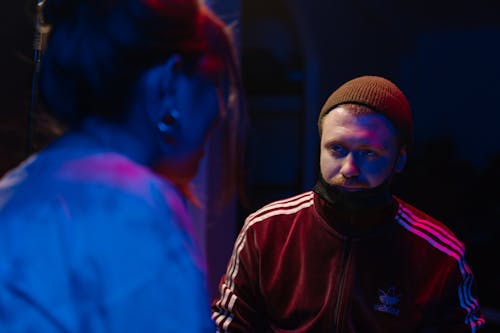 Man in Brown Knit Cap and Red Hoodie