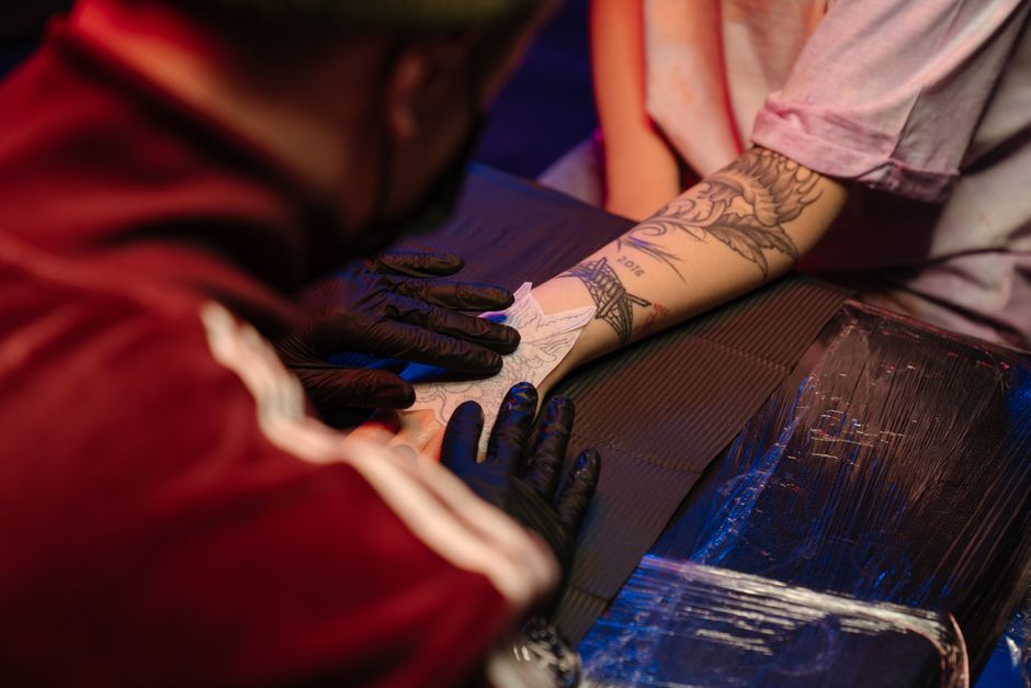 Fresh tattoo healing properly with light redness on healthy skin Fresh tattoo healing properly with light redness on healthy skin