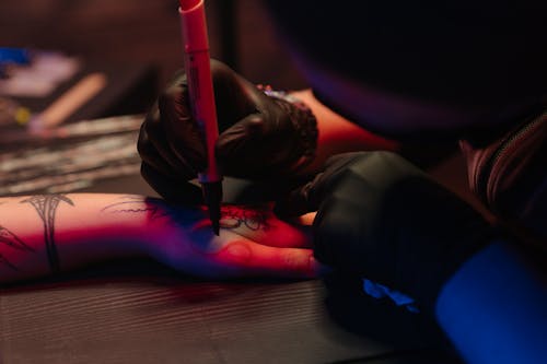 Person in Black Pants Lying on Floor