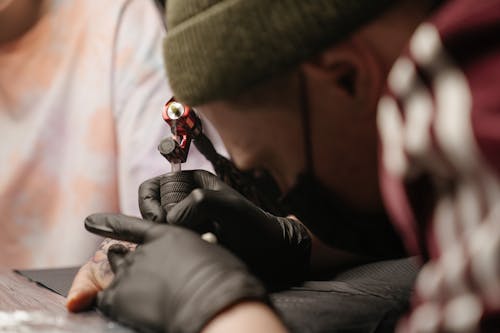 Person in Black Gloves and Black Gloves