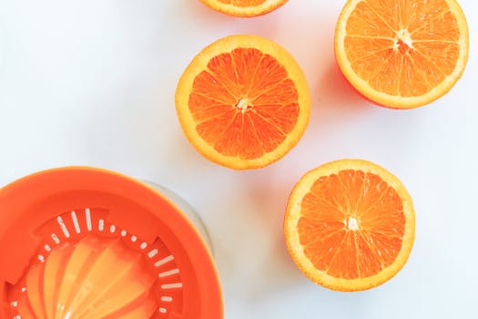 Top view of orange slices with a juicer, highlighting freshness and vitamin C.