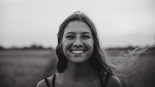 Free Woman in Black Tank Top Smiling Stock Photo