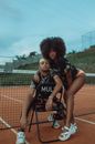 Black woman hugging male friend