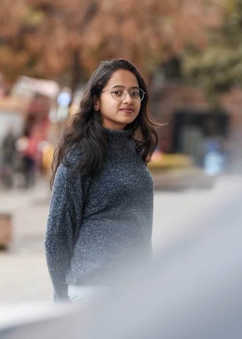 Photo Of Woman Wearing Grey Sweater