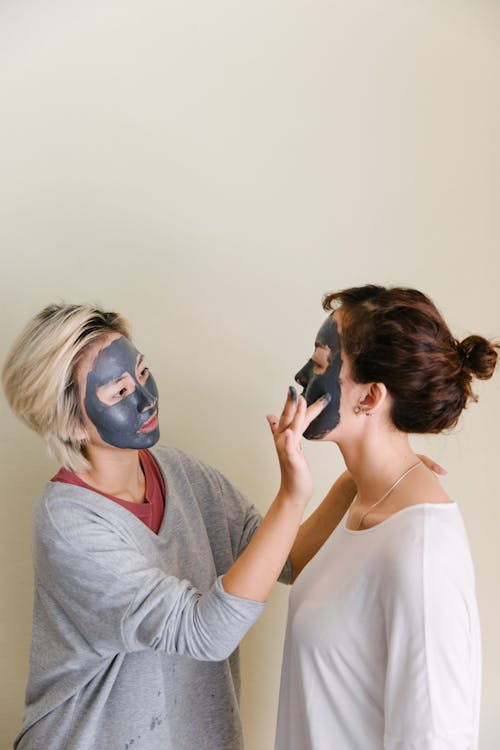 Free Women Putting Beauty Masks Stock Photo