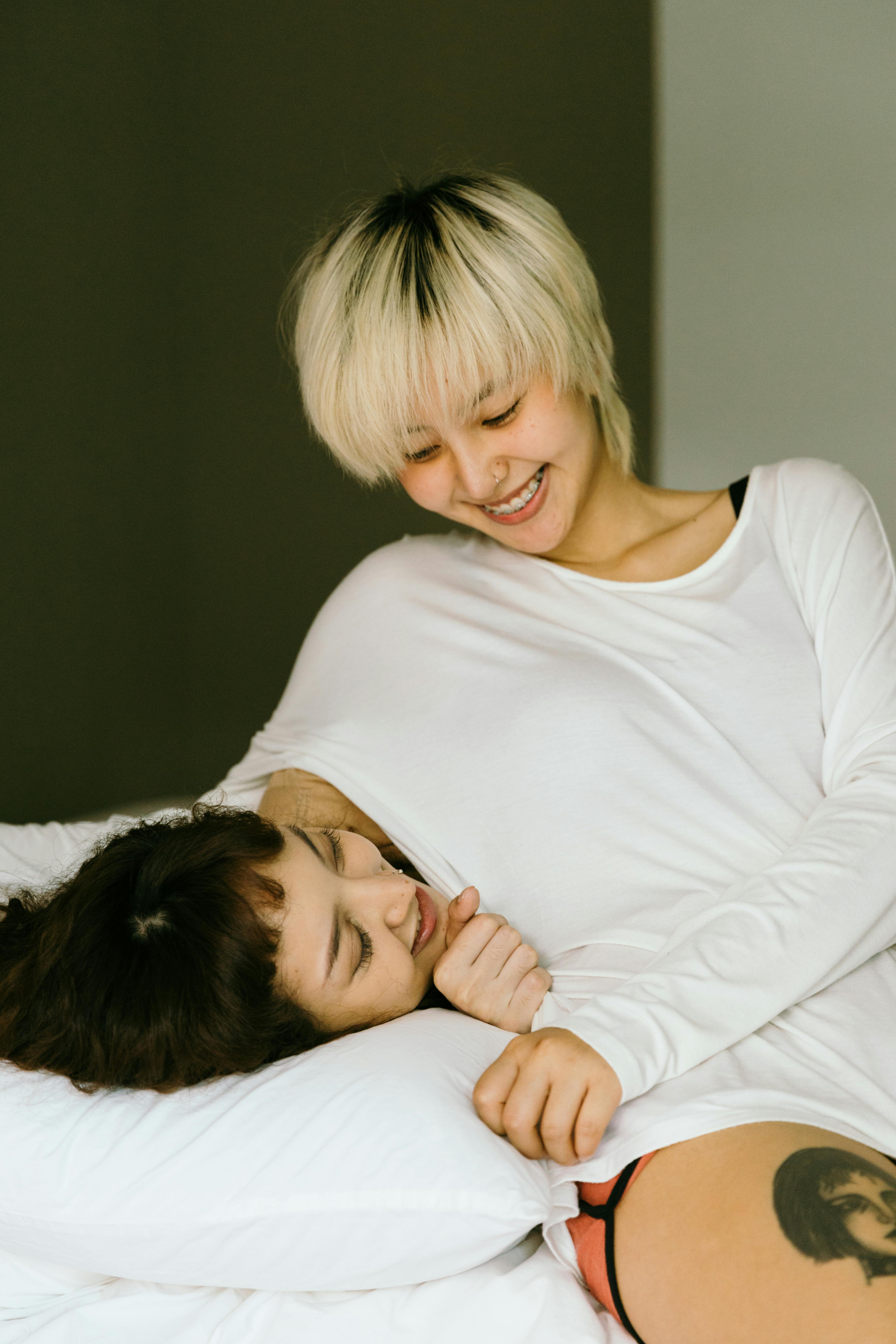 women smiling in bed