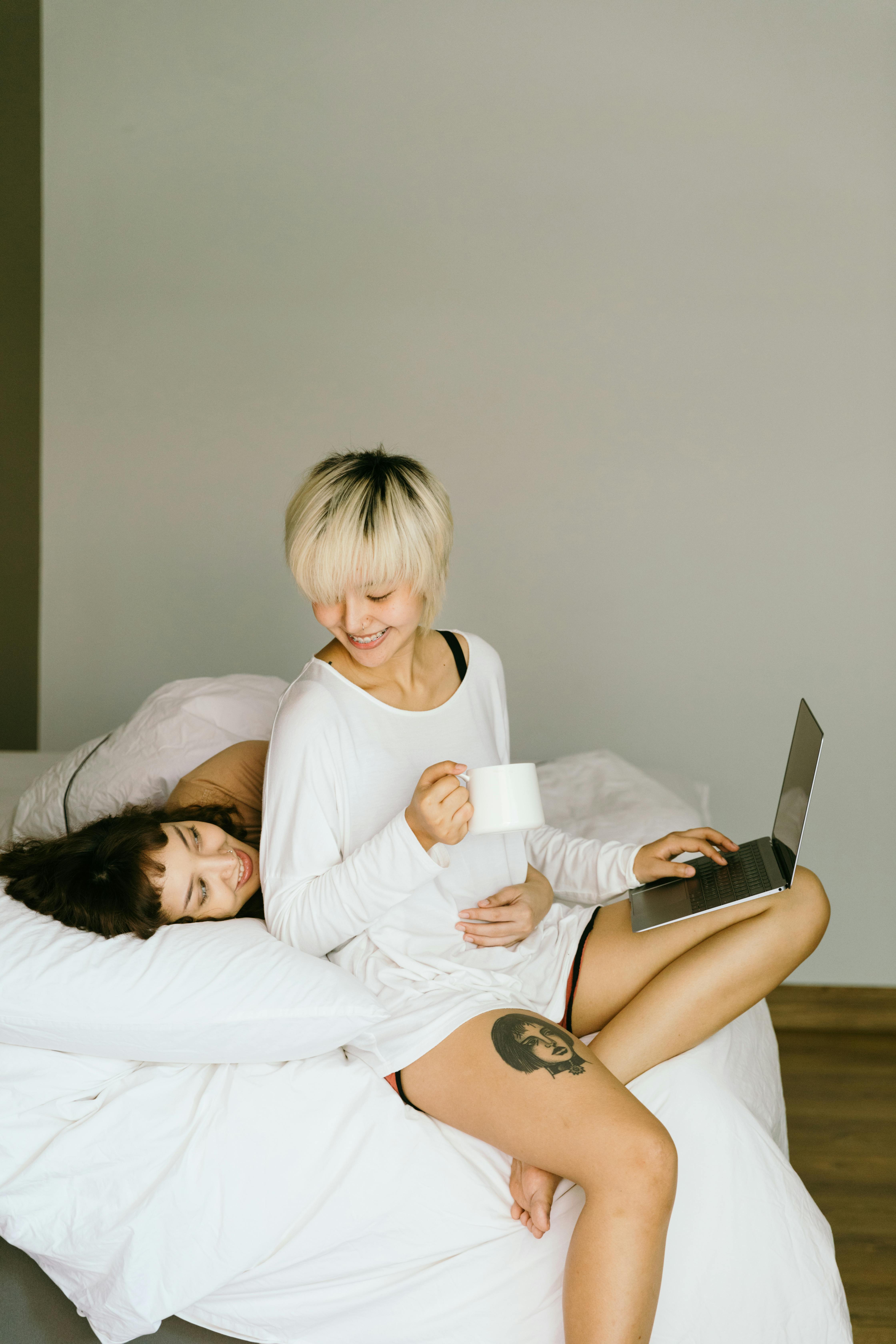 young woman cuddling her girlfriend