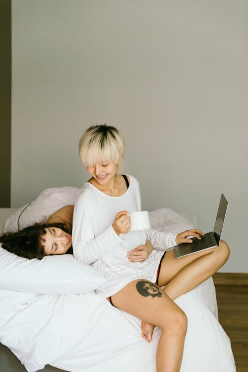 Free Young Woman Cuddling her Girlfriend Stock Photo