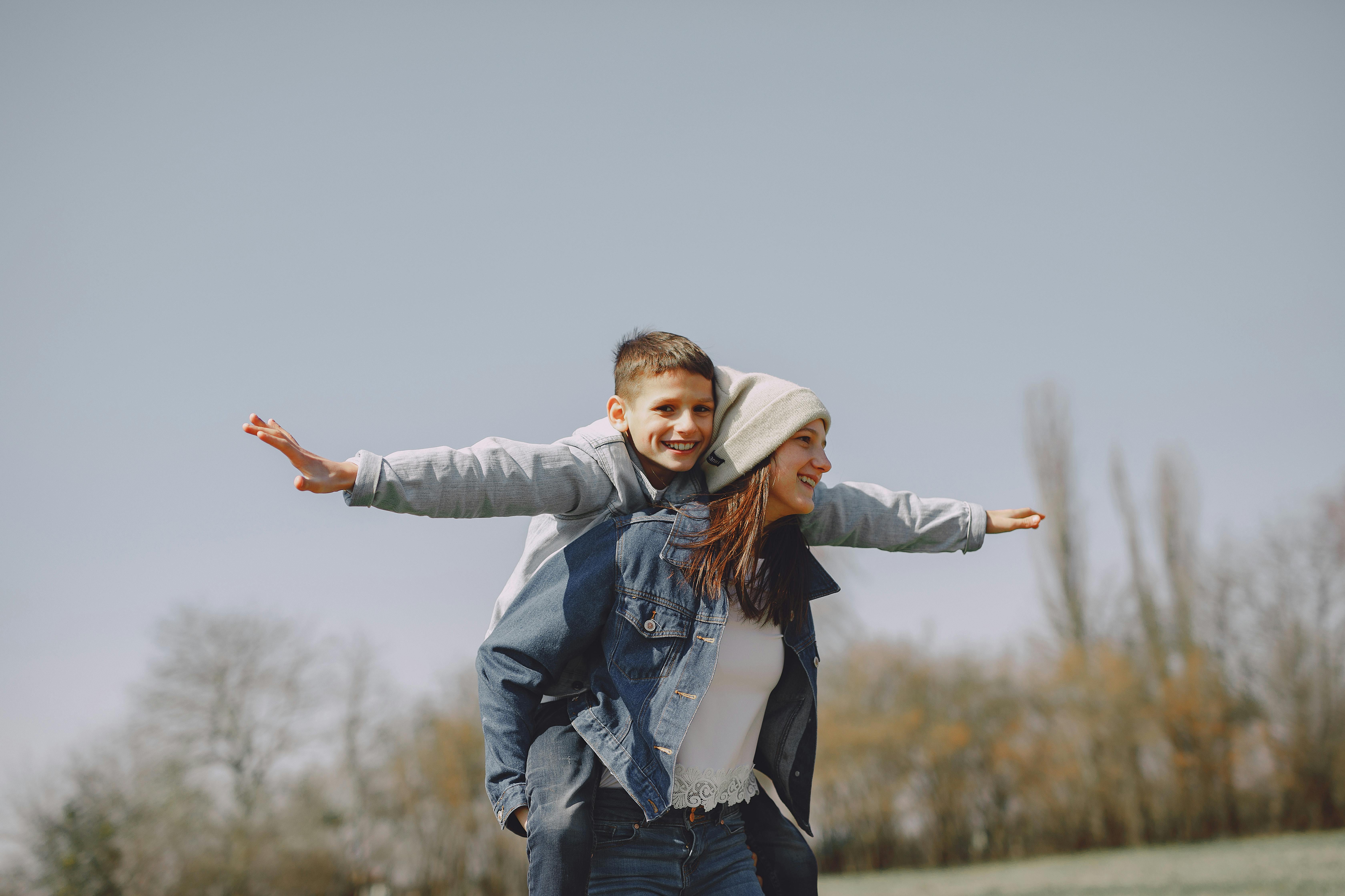 brother and sister having fun in nature