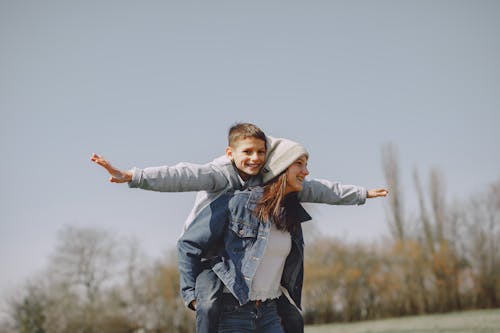 Free Brother and sister having fun in nature Stock Photo
