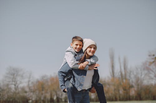 Brother and sister spending time together in nature