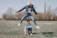 Joyful young friends playing in park