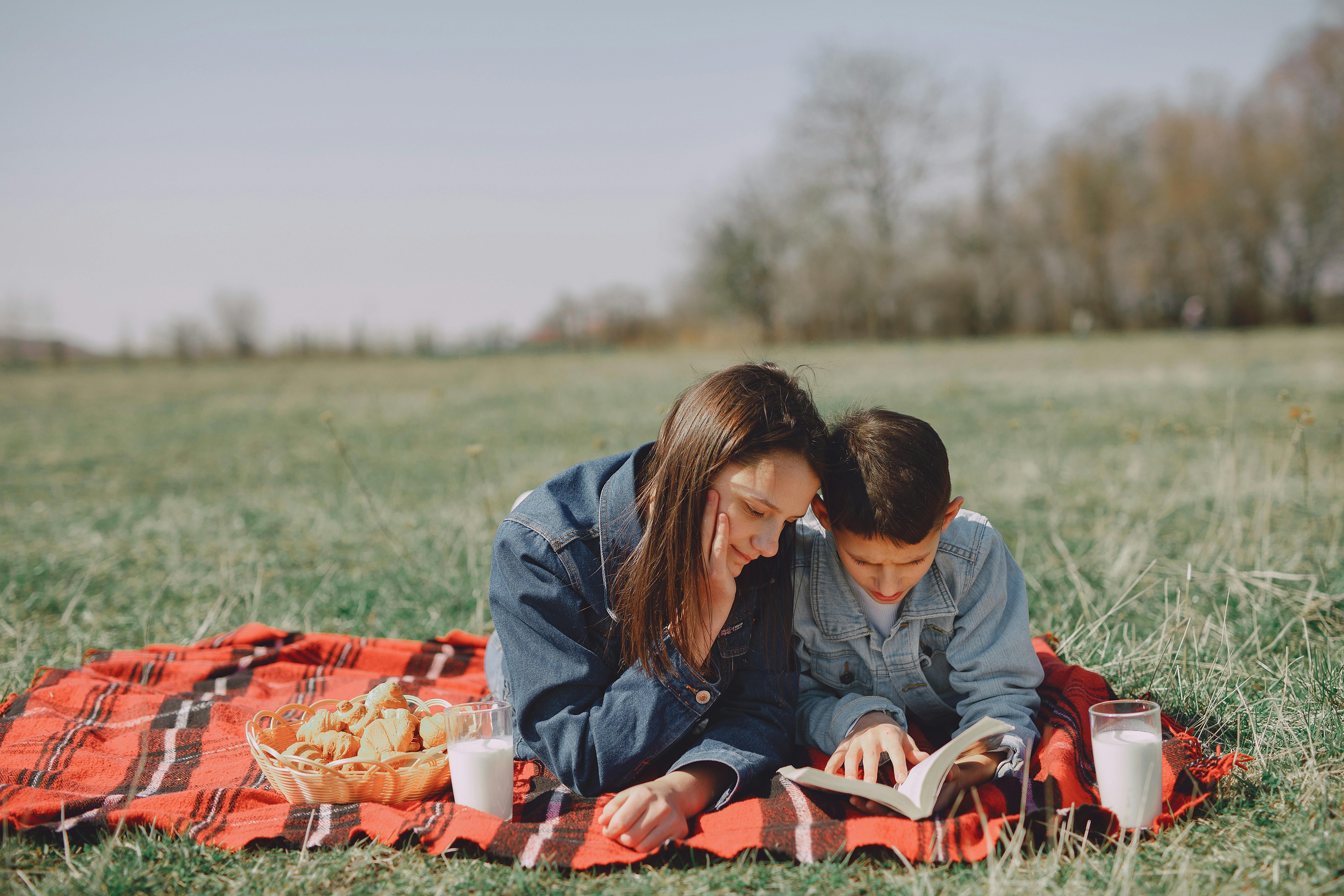 happy friends having picnic in park