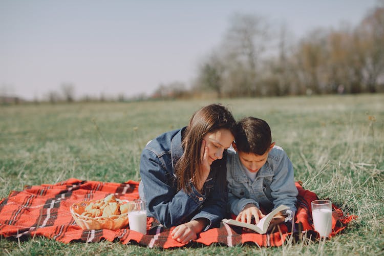 Happy Friends Having Picnic In Park