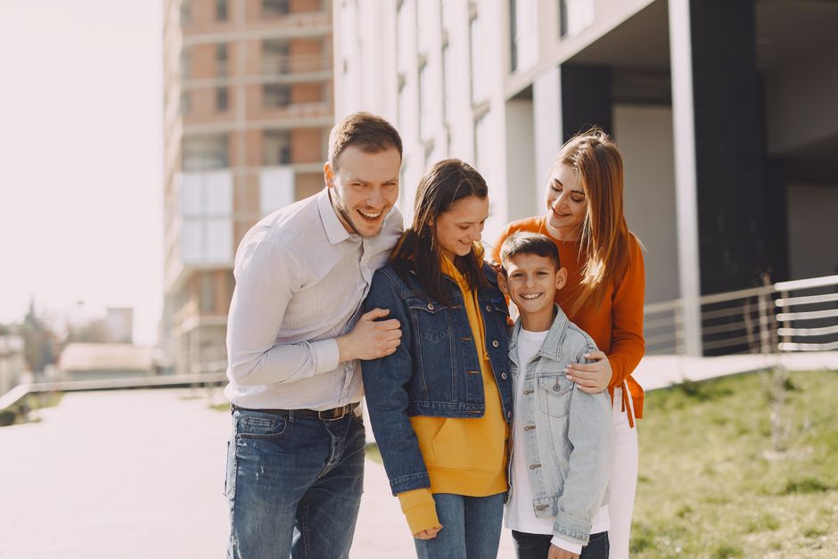Photo by Gustavo Fring on Pexels Delighted family in trendy casual wear holding each other and standing near modern building on city street while walking together during weekend - Photo by Gustavo Fring on Pexels