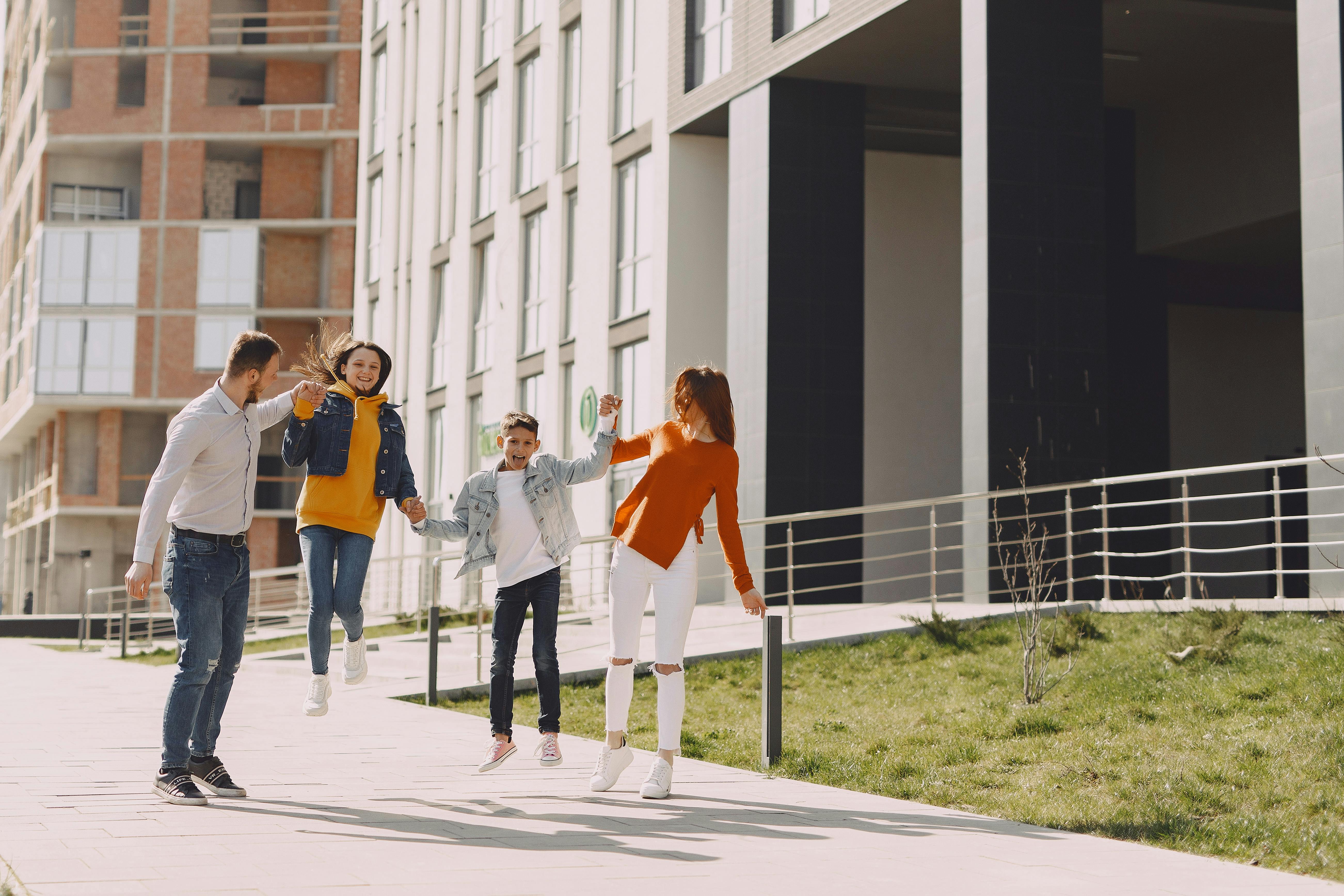 cheerful family walking together on street