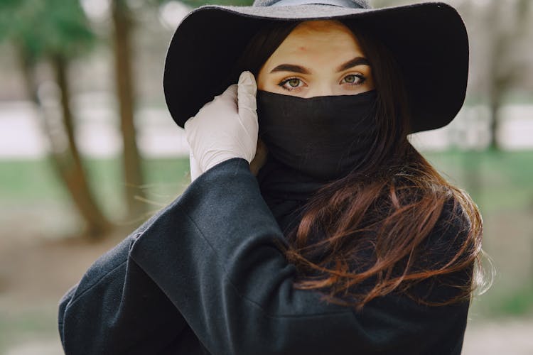 Woman In Protective Gloves And Mask In Park