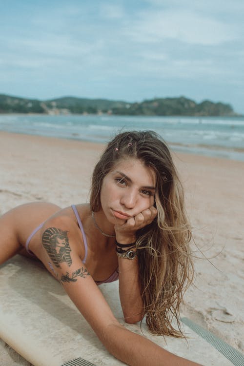 Free Photo Of Woman Laying On Surfboard Stock Photo