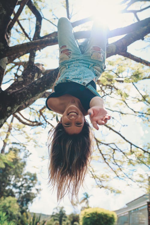 Photo Of Woman Hanging On The Tree Upside Down 