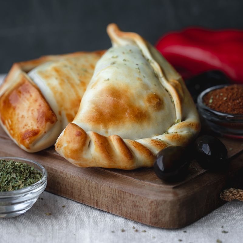 Baked Beef Empanadas with Olives and Raisins