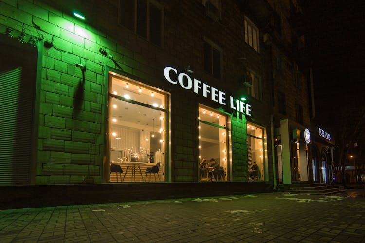 Glowing Signboard Of Coffee Shop At Night