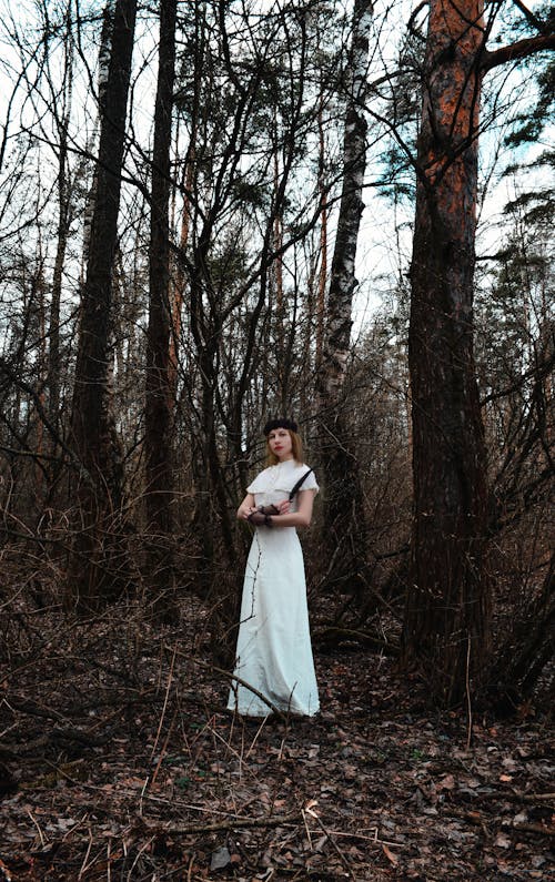 Dramatic lady in gloomy woods