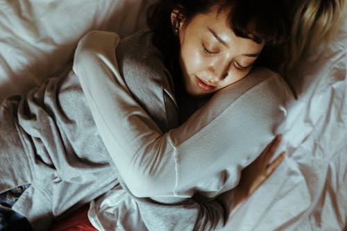 Free Women Hugging in Bed Stock Photo