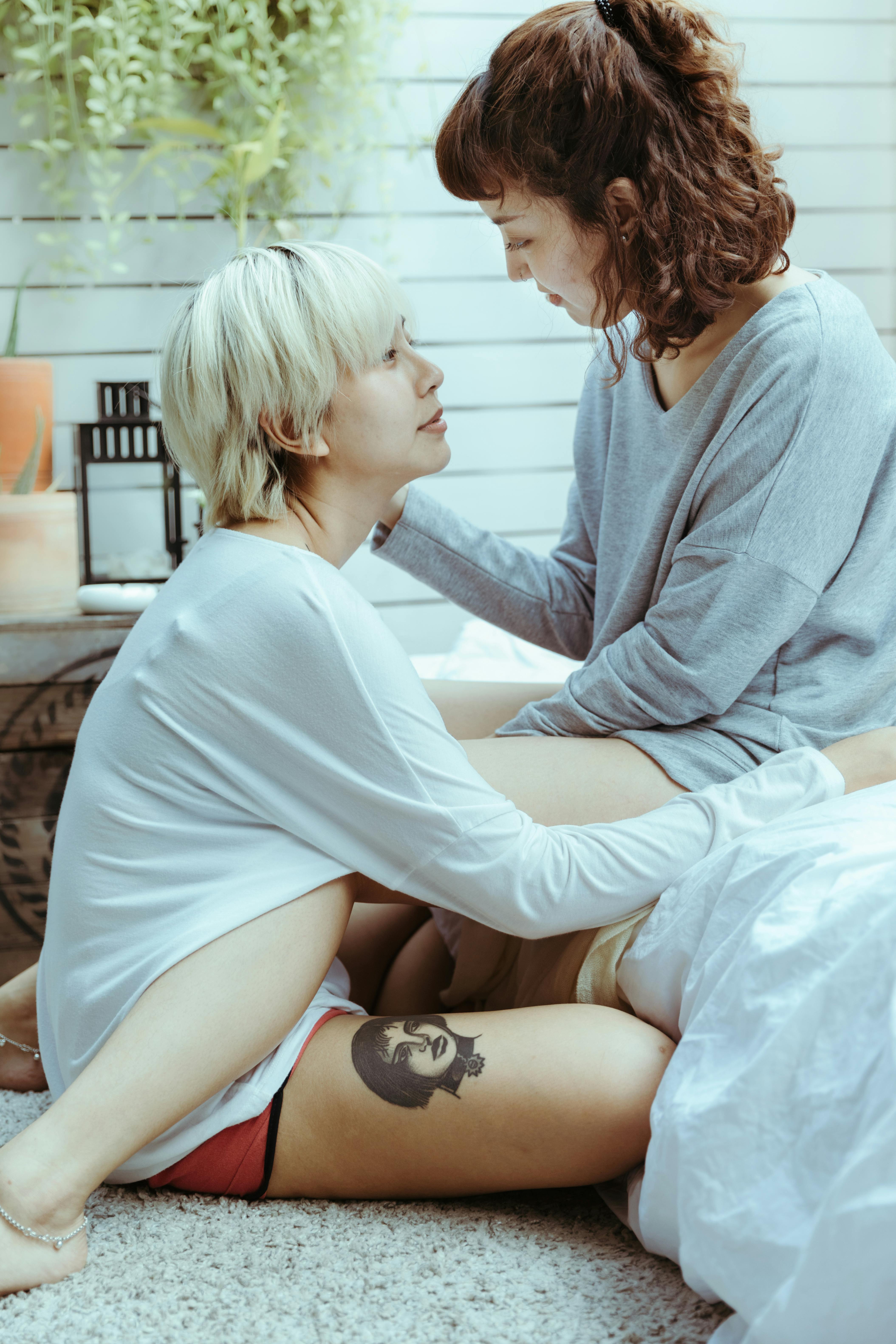 gentle ethnic couple of women looking at each other